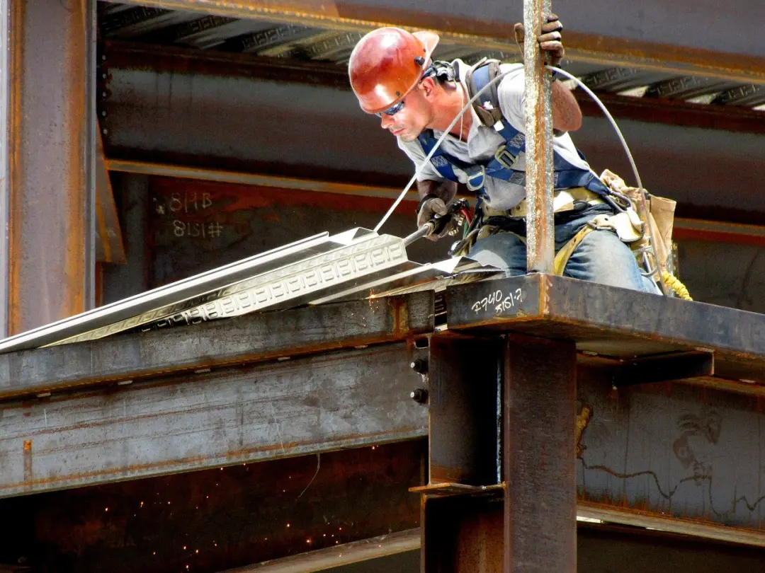 Steel erector working on a steel frame